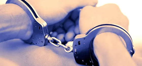 Hands in handcuffs representing affordable bonds services in Forest Acres, SC