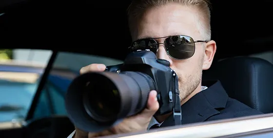 A private investigator with a camera, highlighting the agency's commitment to evidence gathering in Columbia, SC.