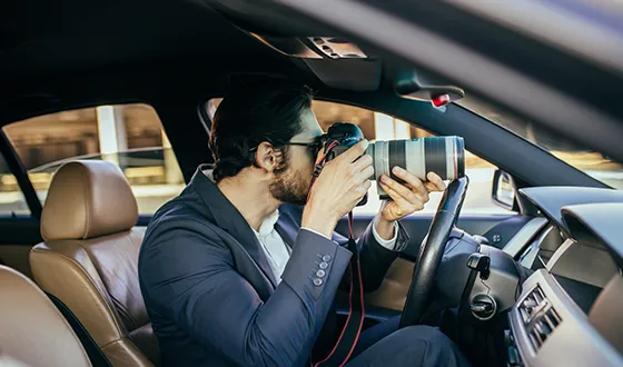 Private investigator in a car, offering private investigator services in Archer Lodge, NC