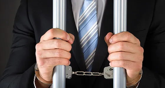 Two hands in handcuffs, symbolizing reliable bail bonds services in Archer Lodge, NC